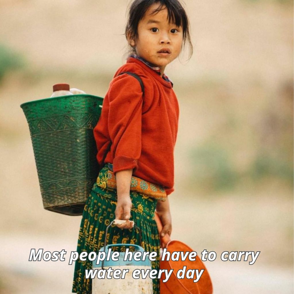 A child in Ha Giang carrys water 